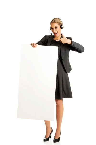 Call center woman holding empty blank — Stock Photo, Image