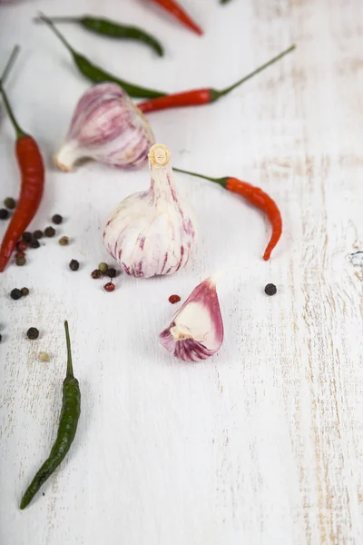 Vegetables and spices in a wooden table — Stock Photo, Image