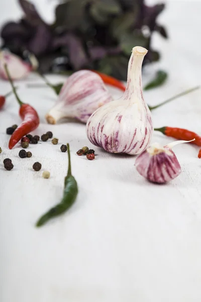 Vegetables and spices in a wooden table — Stock Photo, Image