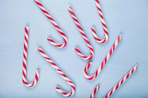 Candy canes on a  wooden background. — Stock Photo, Image