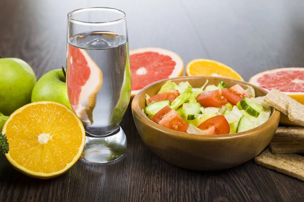 Food for diet on a dark wooden table. Concept of diet and health — Stock Photo, Image