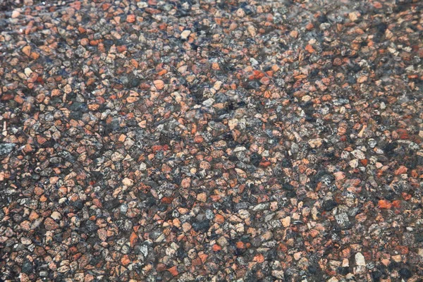 Textuur van een natte stenen weg — Stockfoto
