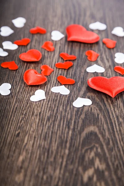 Hearts on a dark wooden background. — Stock Photo, Image