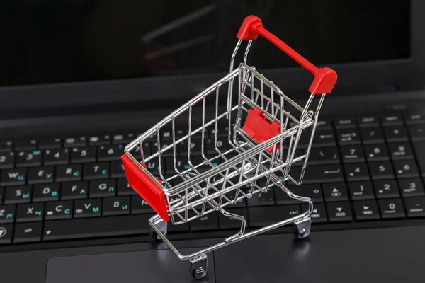 Shopping basket on a laptop.
