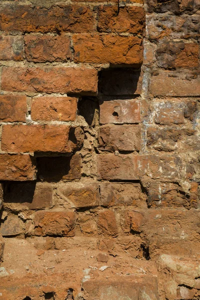 Textur einer Ziegelmauer mit einem Riss. Steinhintergrund. — Stockfoto