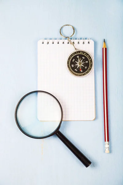 Compass, magnifying glass and  notebook — Stock Photo, Image