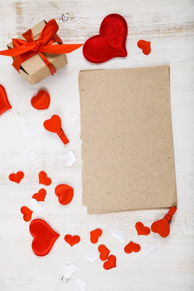 Red and white hearts on a wooden background. — Stock Photo, Image