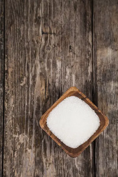 Sugar in a wooden bowl — Stock Photo, Image