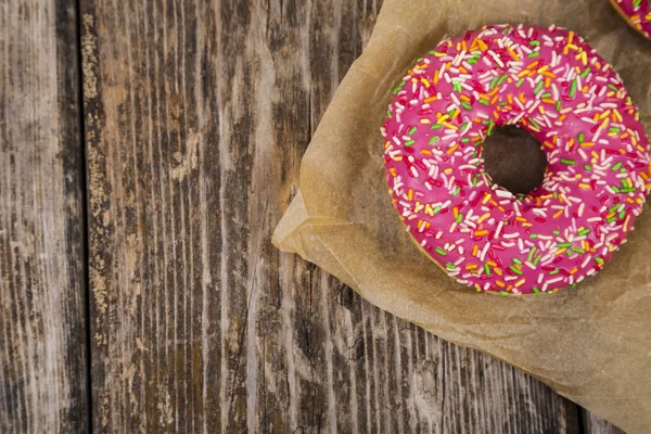 Pink donuts on paper — Stock Photo, Image