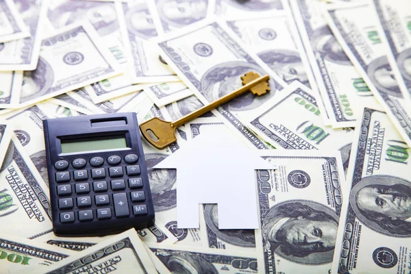 Cardboard house,calculator and key — Stock Photo, Image