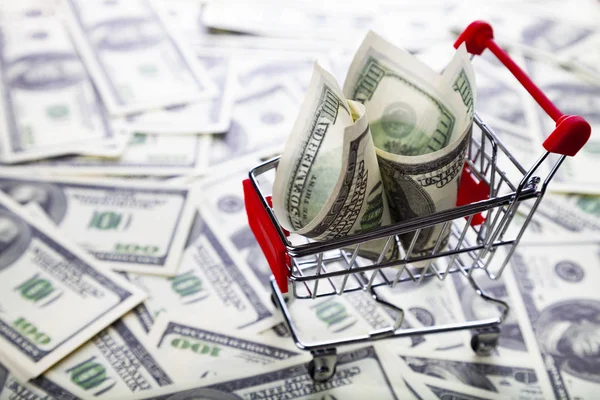 Shopping trolley with dollars. — Stock Photo, Image