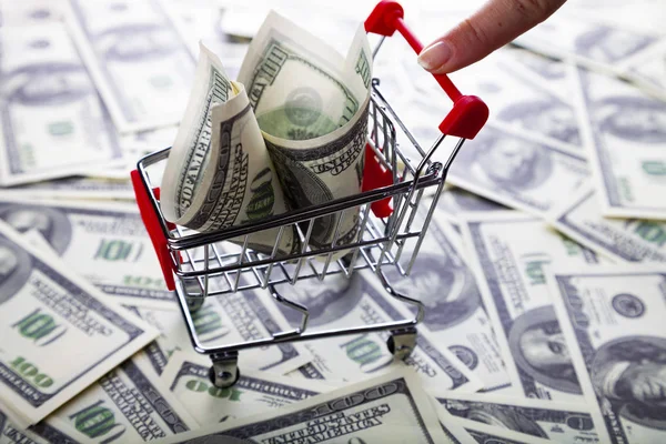 Shopping trolley with dollars — Stock Photo, Image
