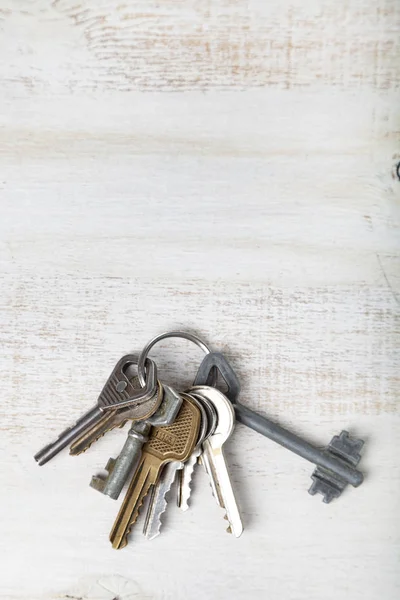Keys on a wooden background. Buying a property.