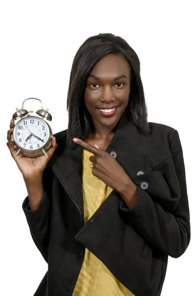 Mulher segurando despertador — Fotografia de Stock