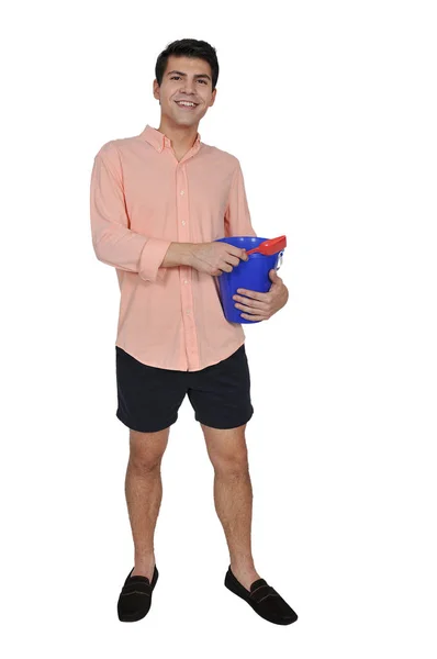 Homem com um balde de areia — Fotografia de Stock