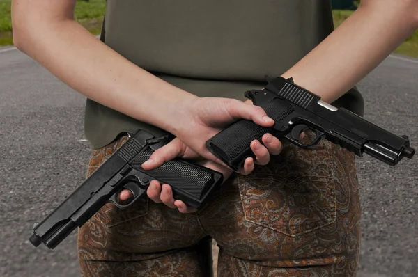 Woman with Guns — Stock Photo, Image