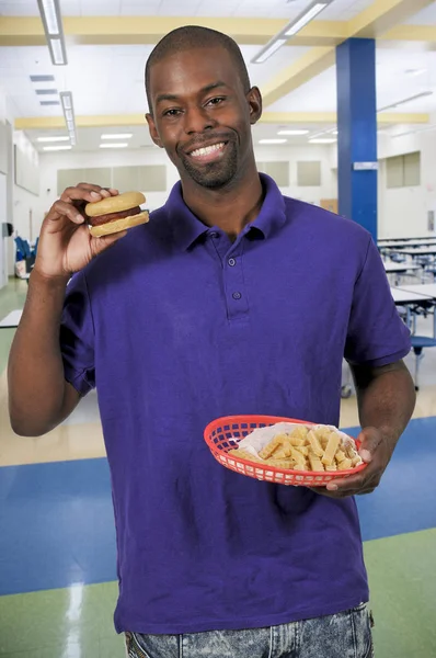 Man eating hamburger