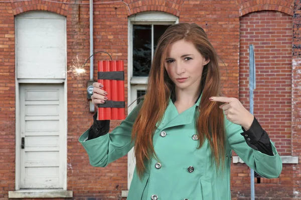 Hot woman holding dynamite — Stock Photo, Image