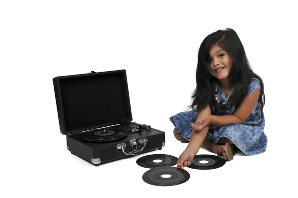 Little girl with vinyl 45 record and player — Stock Photo, Image