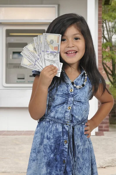 Little girl with cash money — Stock Photo, Image