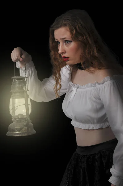 Woman holding lantern — Stock Photo, Image