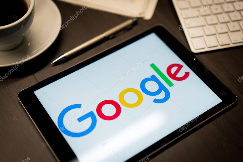 New York, New York / USA - 11 11 2019: Logo of Google on the iPad Air2 in on office desk