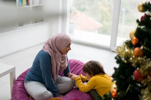 Arabic family with New year holidays tree