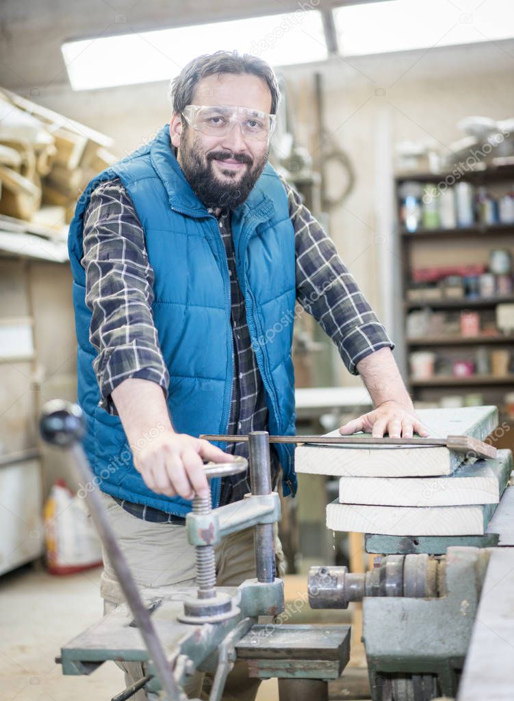 Portrait of workshop crafts man indoors