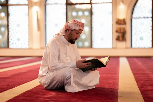 Muslim praying inside beautiful mosque