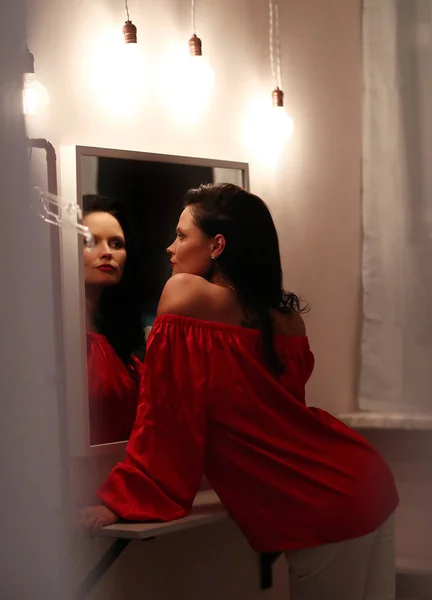 woman posing in the mirror