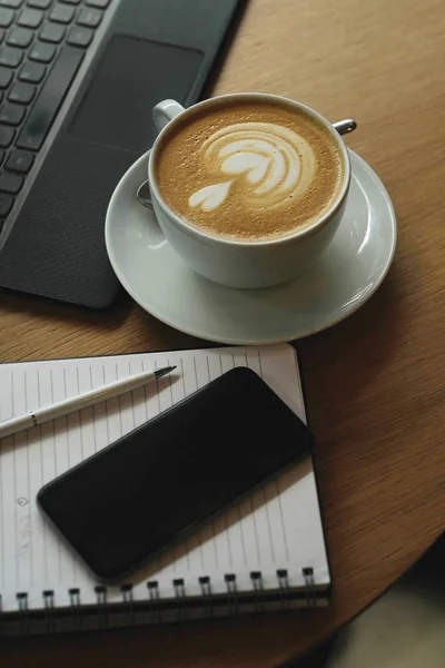 Laptop and cup of coffee