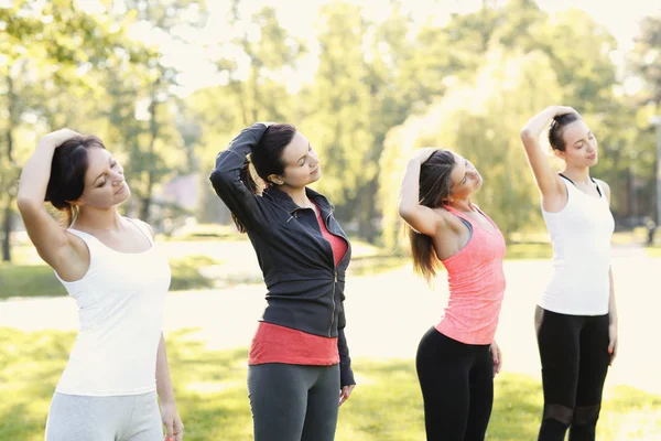 women exercising in park