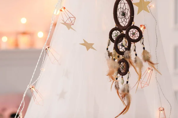 closeup of dreamcatcher home decoration with feathers