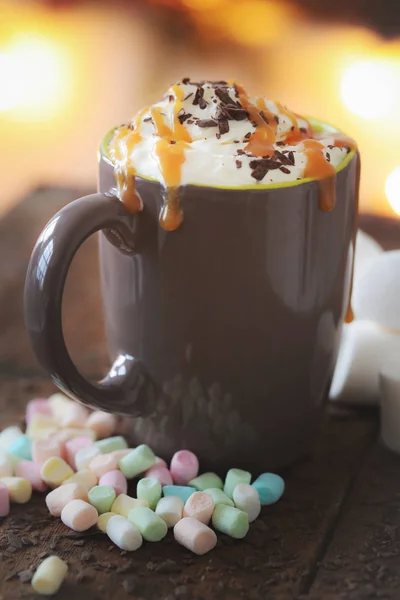 hot sweet coffee in brown cup, caramel frappe with marshmallows