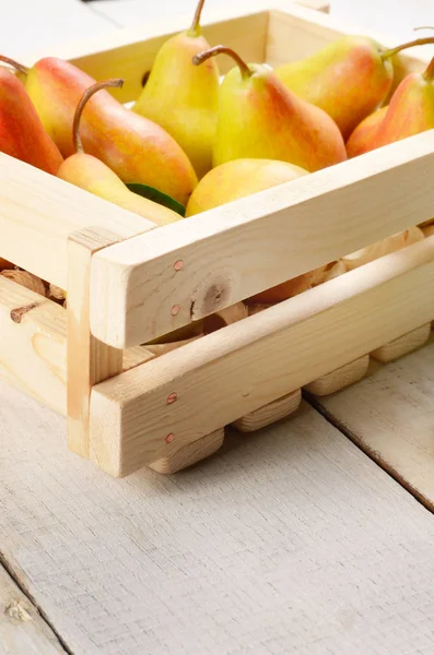 Wooden crate with pears