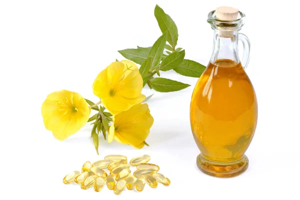 Evening primrose oil with capsules Royaltyfria Stockbilder