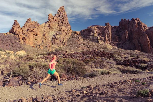 Cross country running in mountains on rocky trail