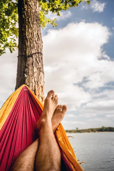 Relaxing in the hammock at the beach under trees, summer day — Stock Photo, Image
