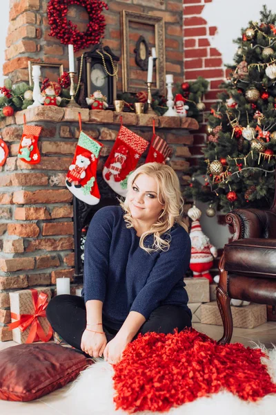 Blond woman  at the Christmas interior — Stock Photo, Image
