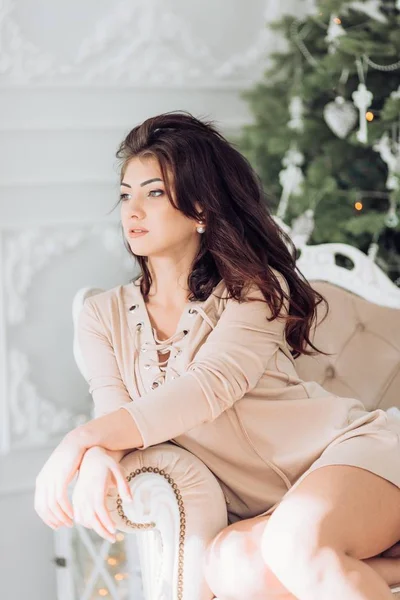 Young woman    at the Christmas interior — Stock Photo, Image