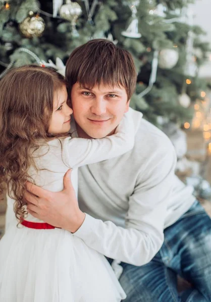 Father and his little daughter near Christmas tree — Stock Photo, Image