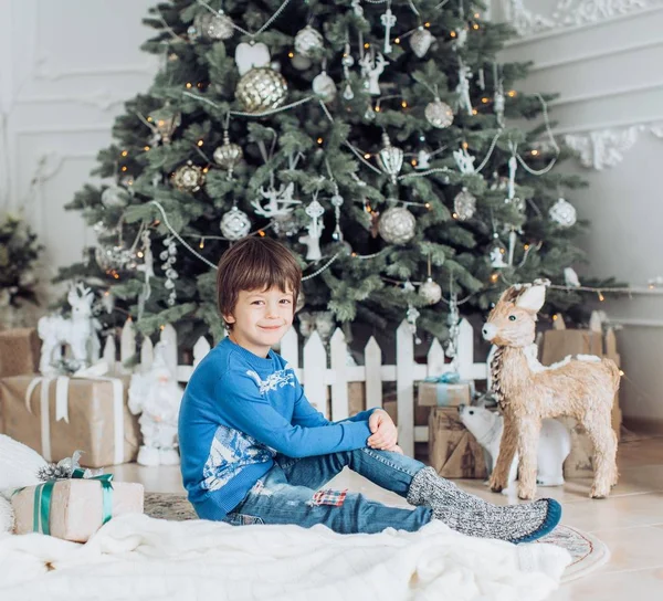 Happy little boy near Christmas tree — Stock Photo, Image