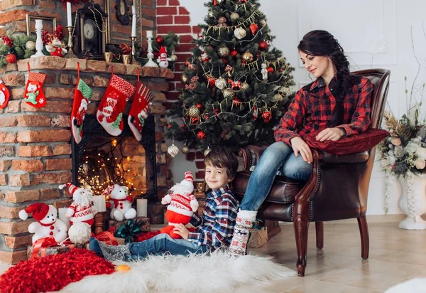 family  at home with decorated Christmas interier