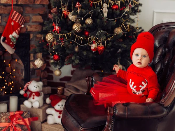 Girl in red dress with Christmas tree decoration — Stock Photo, Image