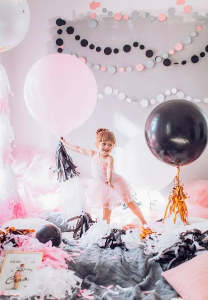 Baby girl with  balloons in room — Stock Photo, Image