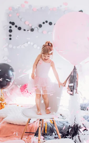 Baby girl with  balloons in room — Stock Photo, Image