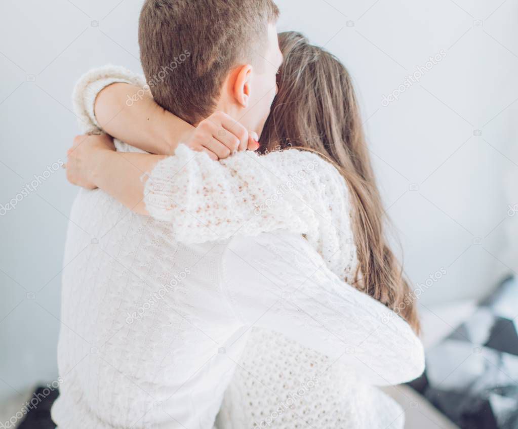 Happy young couple hugging  