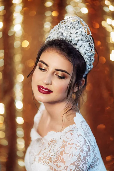 Beautiful young woman in crown — Stock Photo, Image