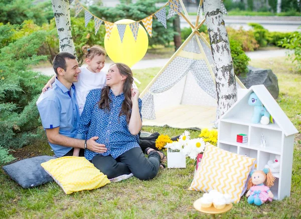 happy family and   tent outdoors