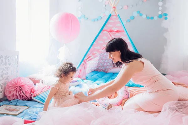 Mother and  baby girl posing at party — Stock Photo, Image